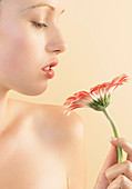 Woman smelling a flower
