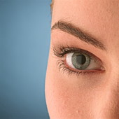 Close-up of a woman's blue eye (front view)