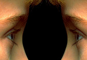 Mirror image of child's face,eye to eye