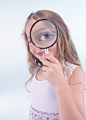 Eye through magnifying glass