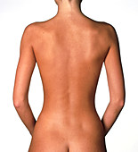 View of a standing woman's naked back