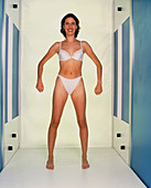 Computer measuring woman's body for fashion design