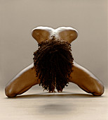 Naked woman bowing