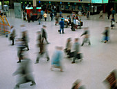 Time exposure image of train station commuters