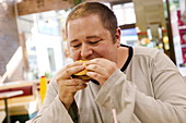 Obese man eating