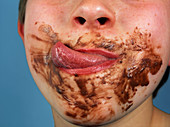 Chocolate around a boy's mouth