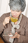 Woman drinking herb tea