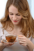 Woman drinking herb tea