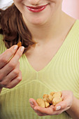 Woman eating almonds