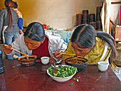 Women eating noodles
