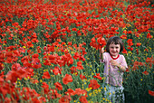 Girl in poppy field