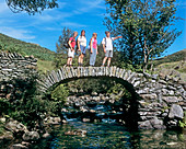 Ramblers on a stone bridge