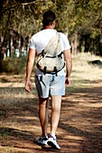 Man walking through woodland