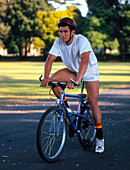 Male cyclist wearing a helmet