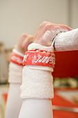 Gymnast gripping a bar