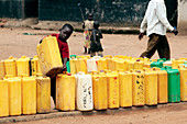 Child and water cans,Uganda
