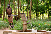 Ugandan child fetching water