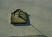 Sundial on the wall of a building