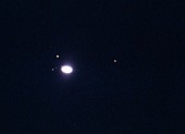 Photograph of Saturn and moons through telescope