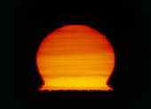 Image of a distorted Sun seen at sunset