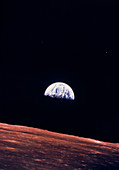 Apollo 10 view of Earth rising over lunar horizon
