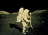Apollo 17 astronaut collecting lunar rock samples