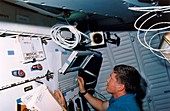 Astronaut Shepherd using portable computer