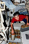 Astronaut Gutierrez changing LiOH cylinder,STS-40