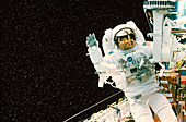Astronaut spacewalks to repair Shuttle Telescope