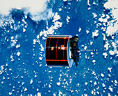The Syncom IV-5 communications satellite in orbit