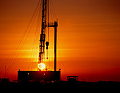 Sunset at an onshore gas drilling rig