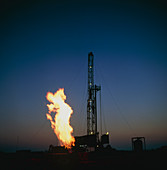 Gas flare at an onshore drilling rig at night