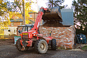 Tractor loading wood chips