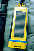 Solar powered torch on a backpack