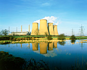 View of a power station reflected in flooded field