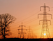 Pylons and power lines at sunset