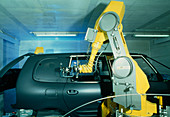 Robot arm using waterjet cutter for car production