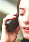 Girl using mobile telephone
