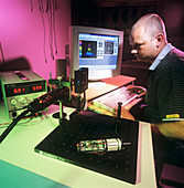 Technician testing a laser diode module