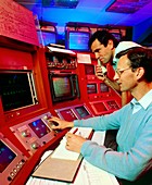 Researcher at controls of CERN SPS ring