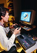 Man playing games on home computer & CD-ROM drive