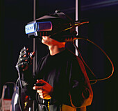 Researcher wearing virtual reality helmet & glove