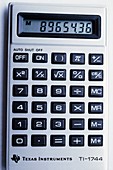 Pocket calculator showing LCD panel & keypad
