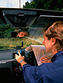 Car driver using hand-held GPS receiver