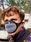 Cyclist wearing anti-smog mask