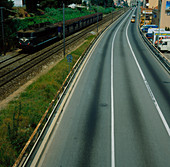 Freeway running alongside a railway