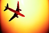 Plane silhouetted against the Sun