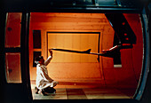 Technician with an aircraft model in a wind tunnel