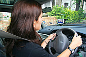 Woman using a satellite navigation system