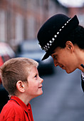Policewoman and small boy